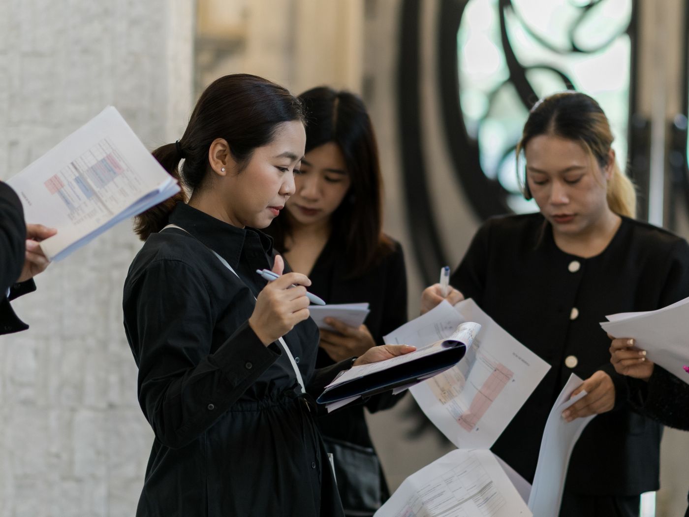 The BFF team reading through the run sheet before a wedding